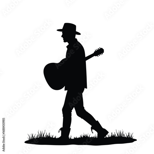 Silhouette of a man in a cowboy hat carrying a guitar