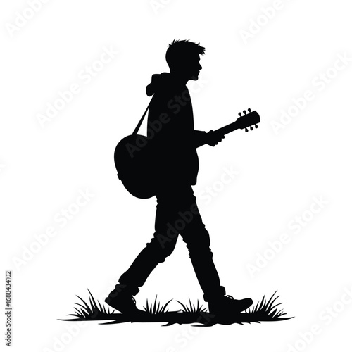 Silhouette of a man walking with a guitar acoustic guitar