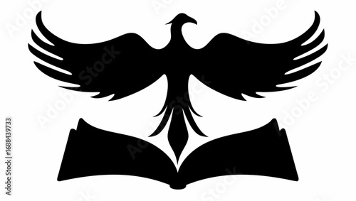 A black silhouette of a phoenix with wings spread above an open book on a white background image view