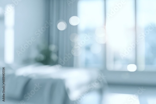 Softly blurred bedroom featuring a bed with draped fabric, a window with curtains, and light-filled bokeh creating a dreamy, tranquil ambiance