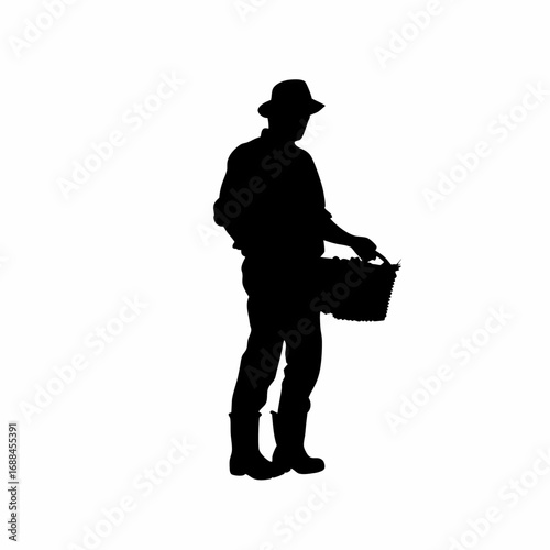 Silhouette of a farmer harvesting grapes with a basket