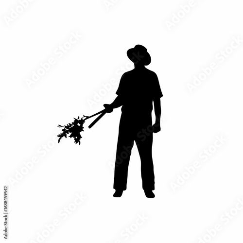 Silhouette of a farmer tending to a vineyard with pruning shears