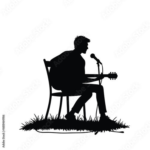 Silhouette of man playing guitar and singing into microphone outdoors 1