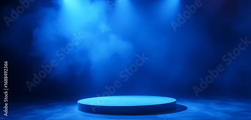  Empty studio with podium in luminous blue mist, spotlight cutting through smoky atmosphere.