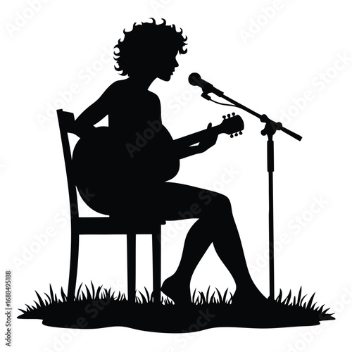 Silhouette of a woman playing guitar and singing into a microphone 1