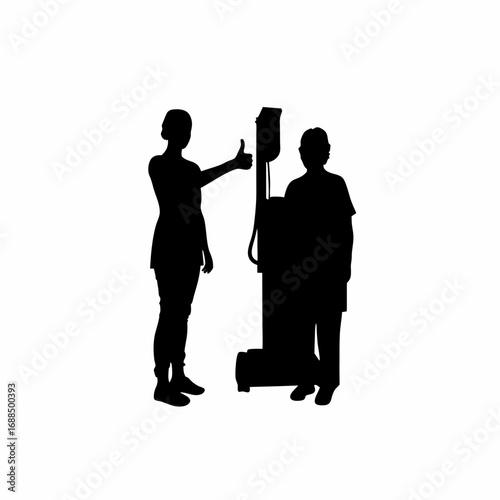 Technician giving thumbs up to patient after medical machine connection