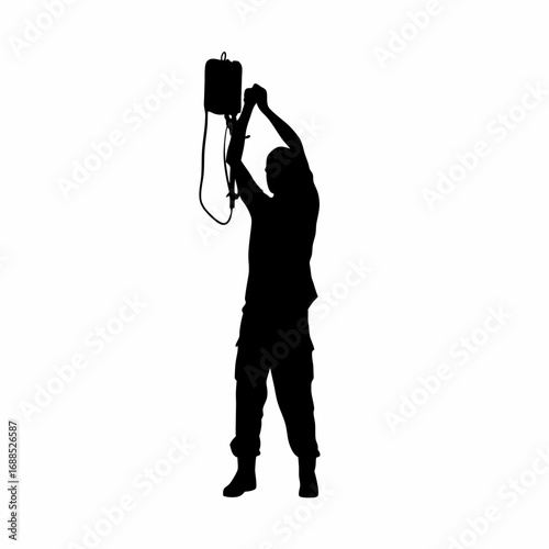 Silhouette of medical professional performing dialysis procedure