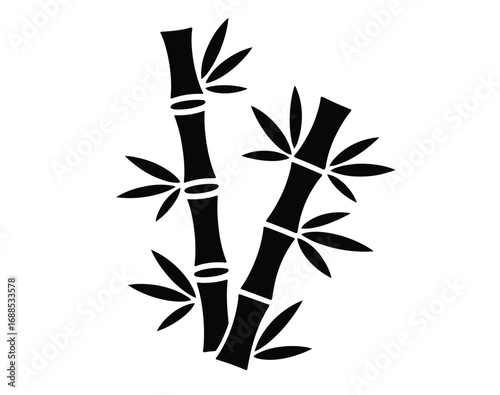 Elegant black bamboo stalks with vibrant green leaves create a serene natural aesthetic