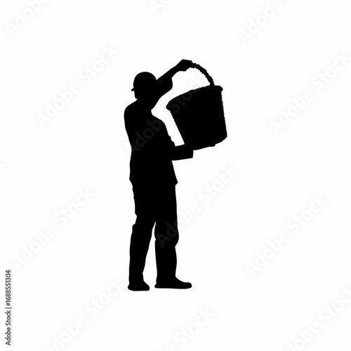 Vineyard worker pouring grapes into harvest machine silhouette
