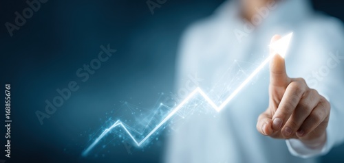 A person in a light shirt touches a glowing upward arrow on a dark blue background, symbolizing growth and progress