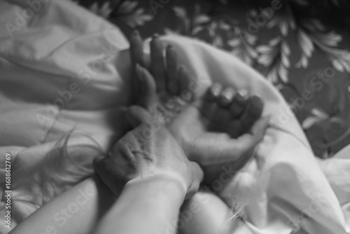 Man and woman couple lying on bed having sex at bedroom