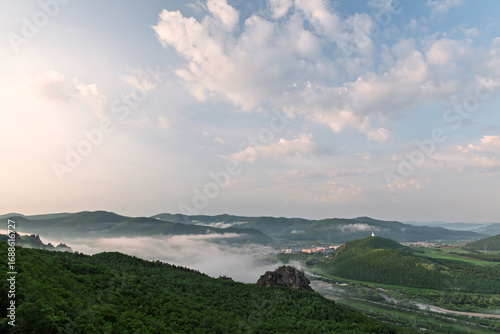 Fotografie Morning Mist over Lama Mountain, Balin Town, Yakeshi City, Inner Mongolia Autono