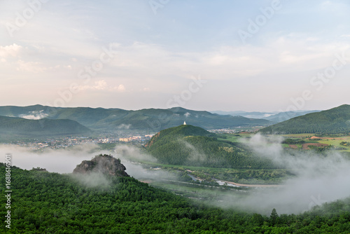 Fotografie Morning Mist over Lama Mountain, Balin Town, Yakeshi City, Inner Mongolia Autono