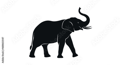 A majestic elephant walking freely in a wildlife sanctuary, viewed from the side.