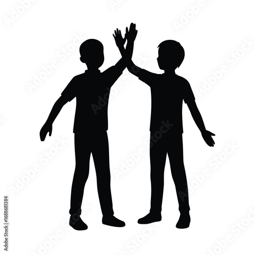 Silhouette of two boys giving a high five