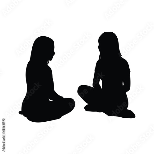 Silhouettes of two girls sitting together