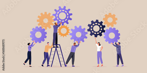 Diverse team of people working together to assemble large interlocking gears for a complex project