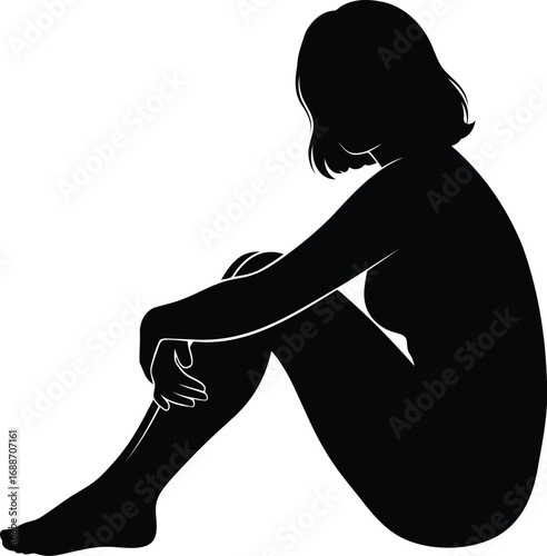 Person curled up in thought, conveying introspection and solitude