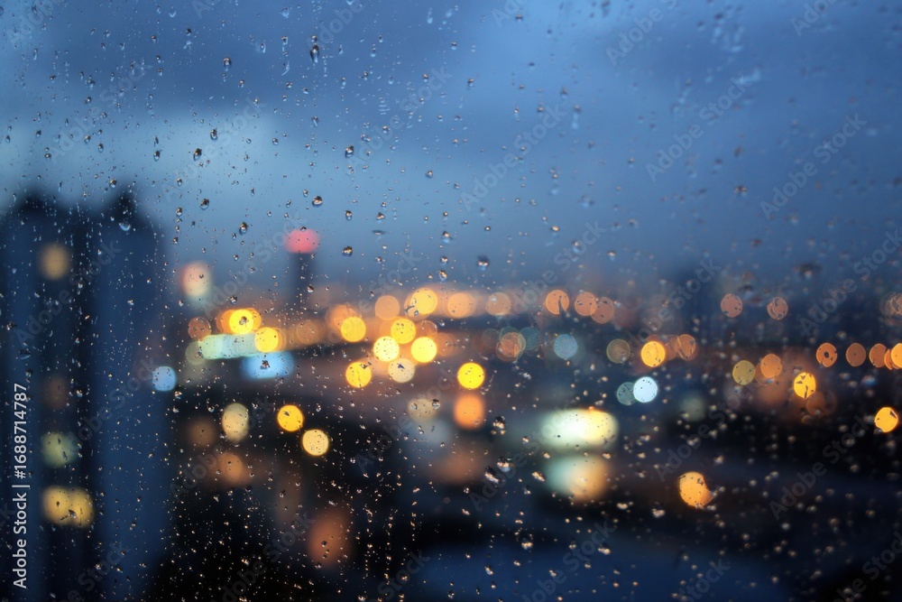 Fototapeta premium Rainy night city view through a window (1)