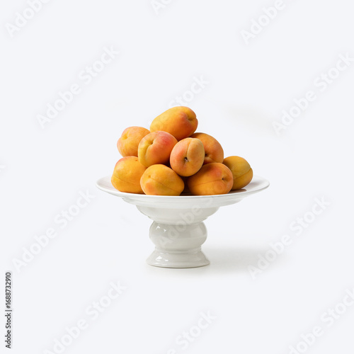 Wallpaper Mural Basket of fresh apricots on white background Torontodigital.ca
