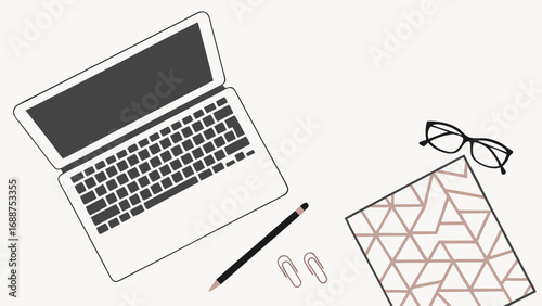 Minimalist workspace flat lay with laptop glasses and stationery.