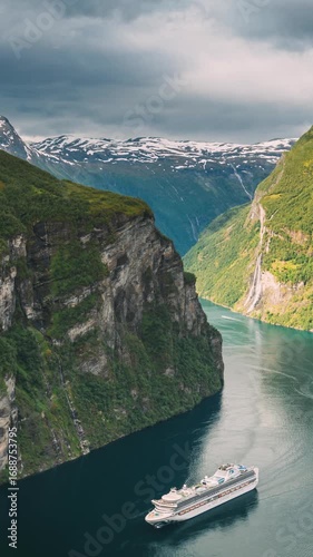 Geirangerfjord, Norway. Touristic Ship Ferry Boat Cruise Ship Liner Floating Near Geiranger In Geirangerfjorden In Summer Day. Famous Norwegian Landmark And Popular Destination.