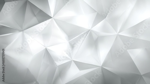 Abstract design showcases a modern geometric pattern with triangular shapes and varying silver shades. The texture adds depth and elegance, suitable for contemporary settings.