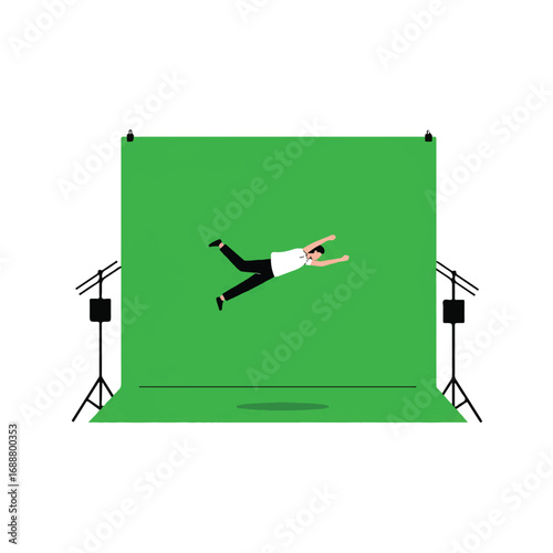 Man in mid-air against green screen in studio.