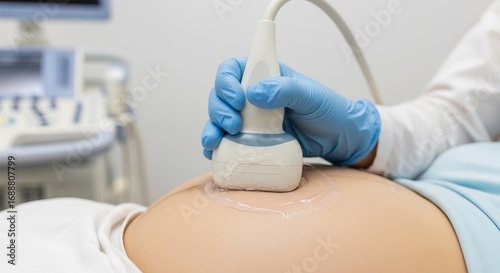 Pregnant woman undergoing ultrasound examination in clinic for prenatal care