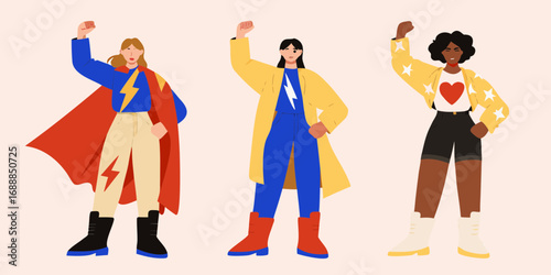 Three diverse women standing strong with fists raised in a powerful superhero pose