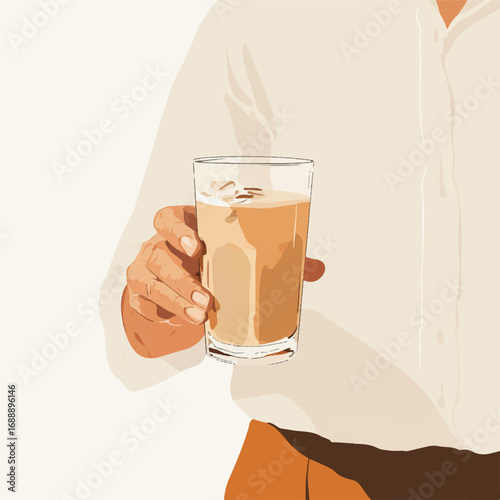 A hand holding a refreshing iced coffee drink in a clear glass.