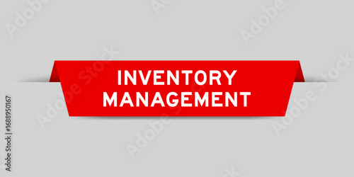 Red color inserted label with word inventory management on gray background