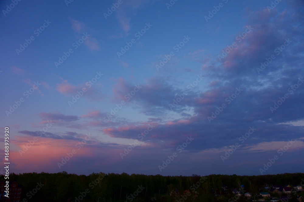 Fototapeta premium Clouds over the forest in summer