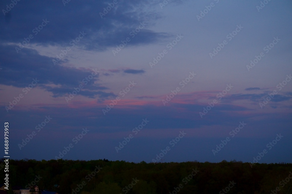 Fototapeta premium Clouds over the forest in summer