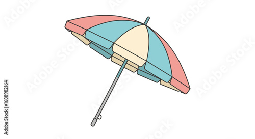 A colorful beach umbrella tilted open on a bright sunny day providing shade from the sun on vacation