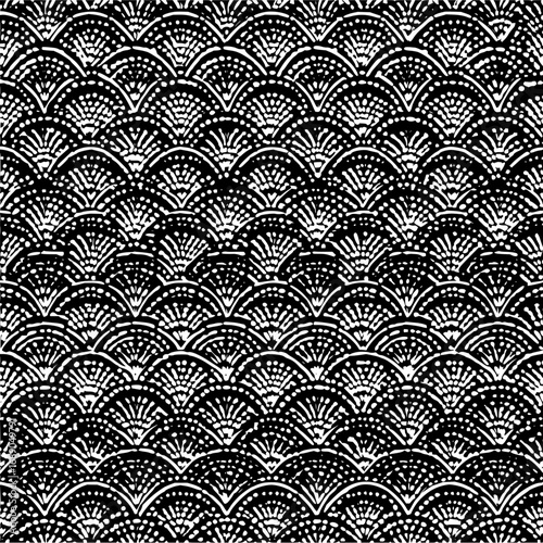 Monochrome pattern featuring rows of stylized fan shapes with dotted and radiating line details repeating across the image