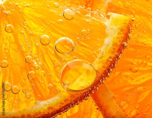 Refreshing Orange Slices with Bubbles in Sparkling Water for a Summer Drink