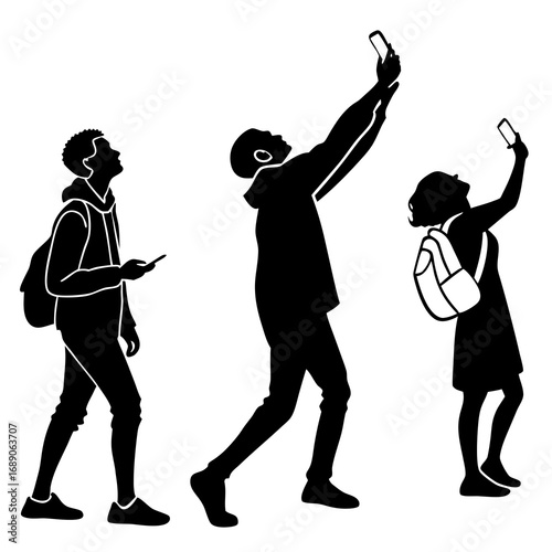 Diverse group of young people taking selfies and using smartphones while walking outdoors