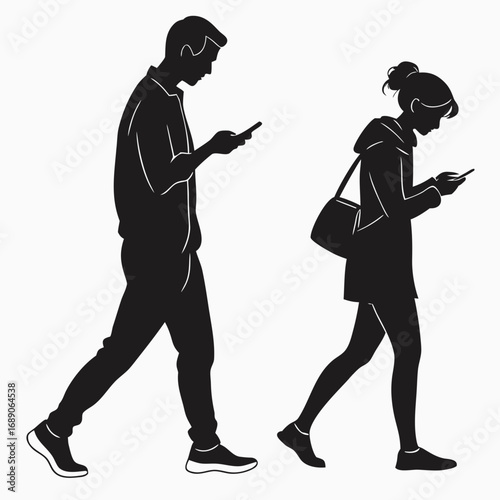 Silhouettes of a man and a woman walking while looking at their mobile phones