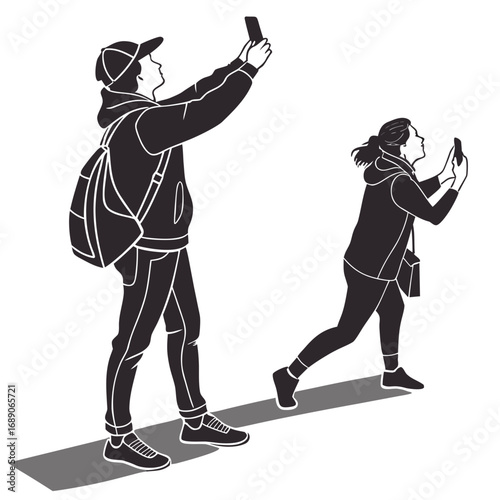 Young man and woman taking photos with their smartphones while walking outdoors