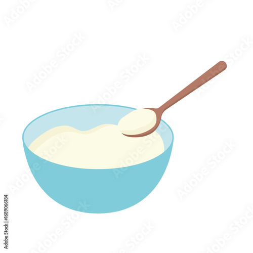 A light blue bowl filled with creamy food, a wooden spoon rests within.