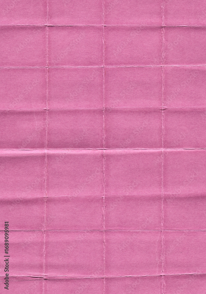 Fototapeta premium scan of pink paper with visible fold lines and creases arranged in a grid pattern. The surface texture highlights the natural imperfections of folded paper, giving it a worn and tactile look.