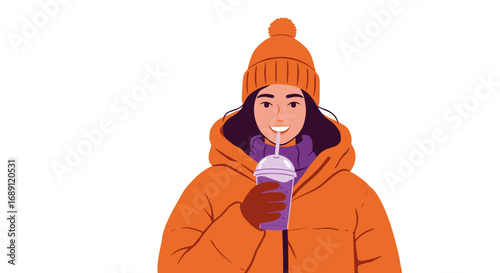 Smiling woman in winter clothes enjoying a cold drink