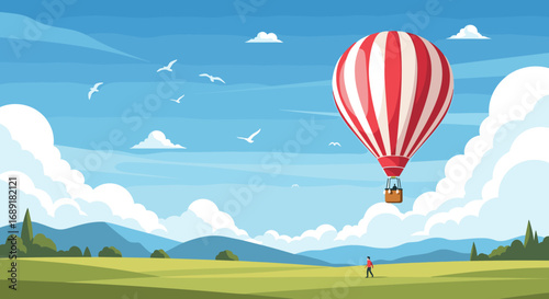 Majestic red striped hot air balloon ascends over a verdant landscape under a beautiful sky