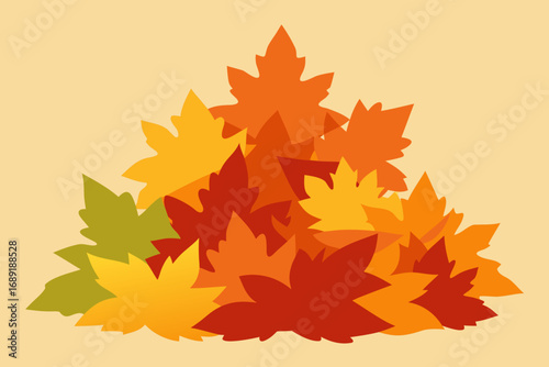Pile of autumn leaves in warm colors on a light background