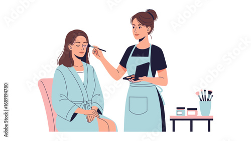 Professional makeup artist applying cosmetics to a client sitting in a chair wearing a robe