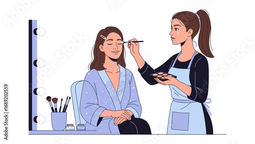 Professional makeup artist applying cosmetics to a client in a salon setting with a vanity mirror and brushes