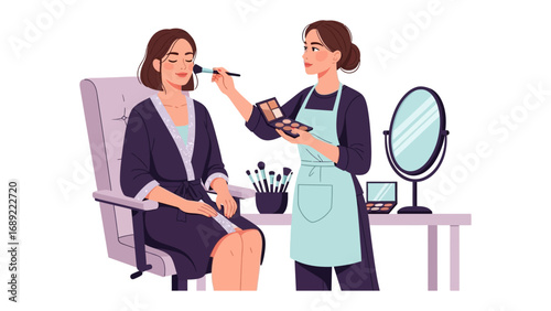Professional makeup artist applying blush to a client sitting in a comfortable chair with makeup tools and mirror nearby