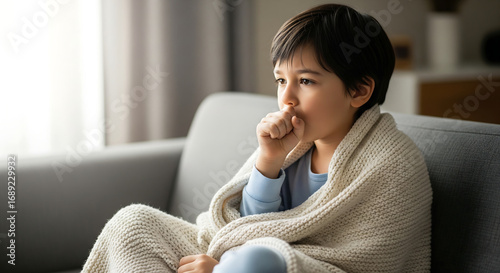 Little Boy Wrapped in Blanket Suffering from a Sickness