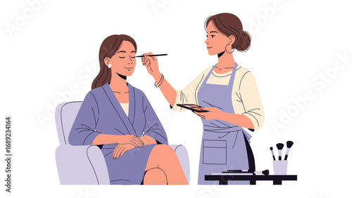 Professional makeup artist applying cosmetics to a seated woman s face with brushes and palette